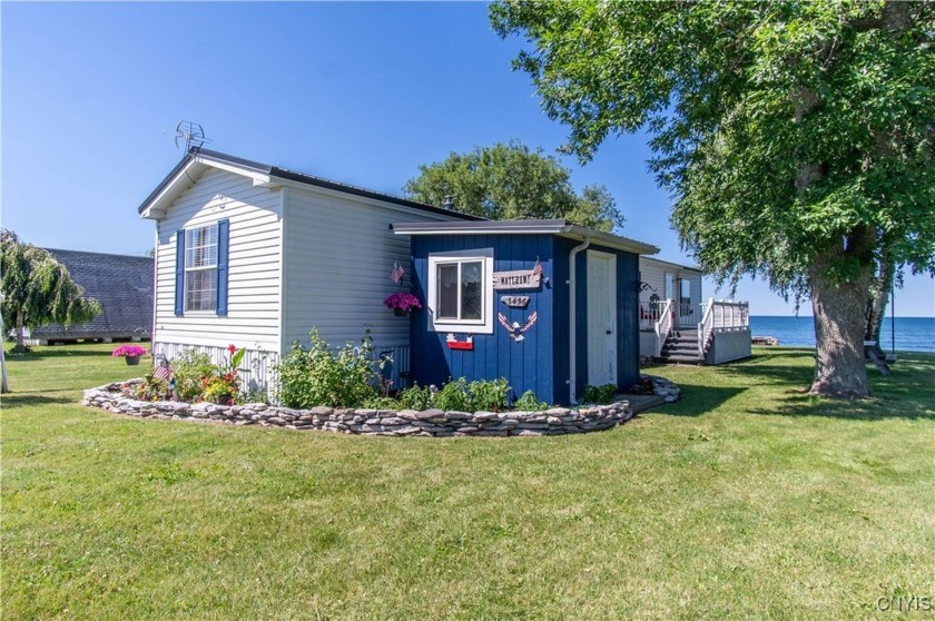 Welcome to the perfect LAKE cottage tucked away on a quiet and - Beach Home for sale in Lyme, New York on Beachhouse.com