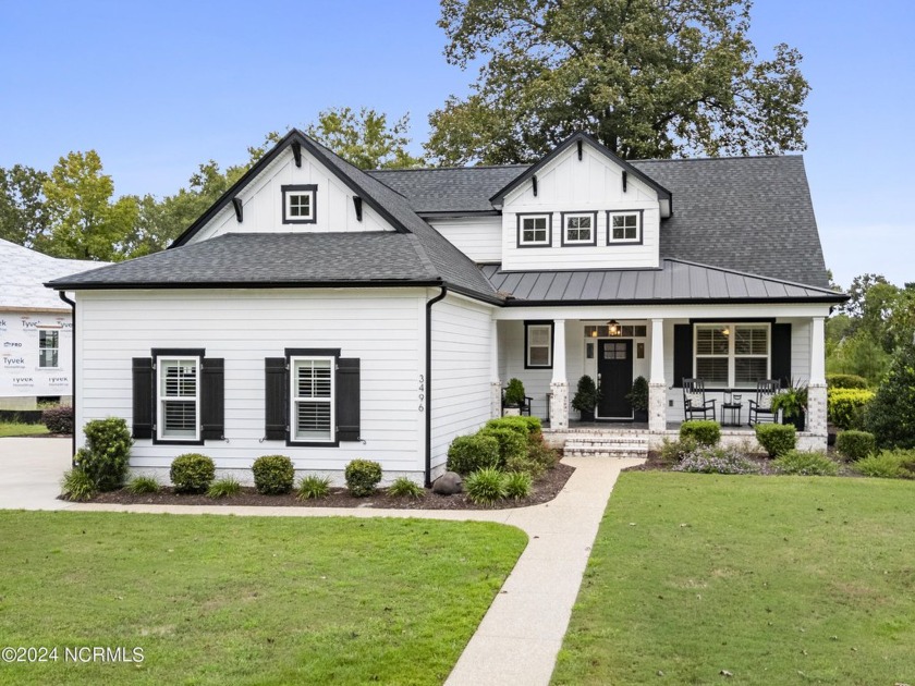 This beautiful home with a 3-car side entry garage, has a master - Beach Home for sale in Leland, North Carolina on Beachhouse.com