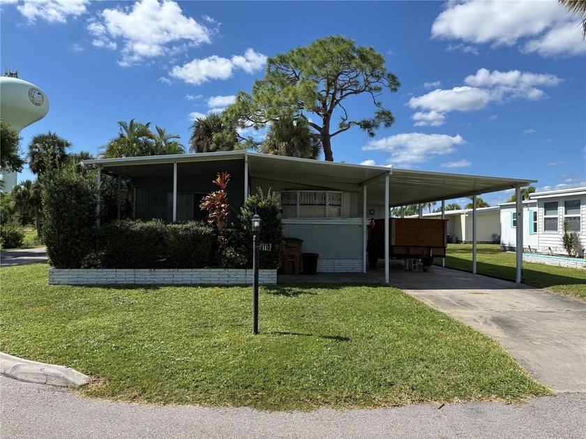 Fixer Upper! Needs TLC! This 960-square-foot doublewide home in - Beach Home for sale in Punta Gorda, Florida on Beachhouse.com