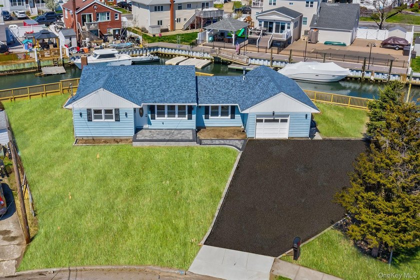 Welcome to this beautifully renovated waterfront home located on - Beach Home for sale in Lindenhurst, New York on Beachhouse.com