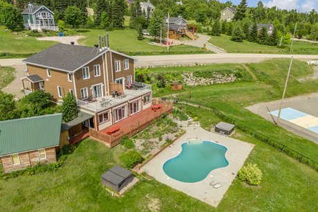 This property is divided into 4 condos and can accommodate a - Beach Home for sale in Petite-Rivière-Saint-FrançOis,  on Beachhouse.com