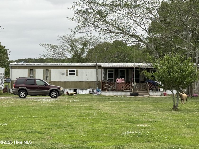 1980 single-wide mobile home on almost an acre lot. currently - Beach Home for sale in Camden, North Carolina on Beachhouse.com