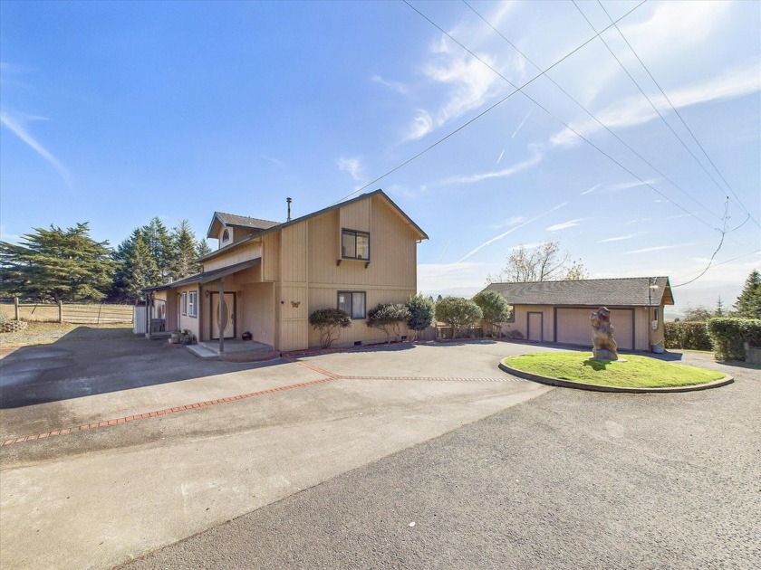 This charming 3-bedroom, 2-bath home sits on a 0.3-acre lot atop - Beach Home for sale in Fortuna, California on Beachhouse.com