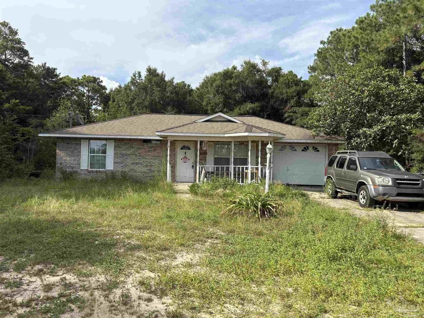 Calling ALL INVESTORS!!!!! 3/1 1054sq ft all brick home in - Beach Home for sale in Navarre, Florida on Beachhouse.com