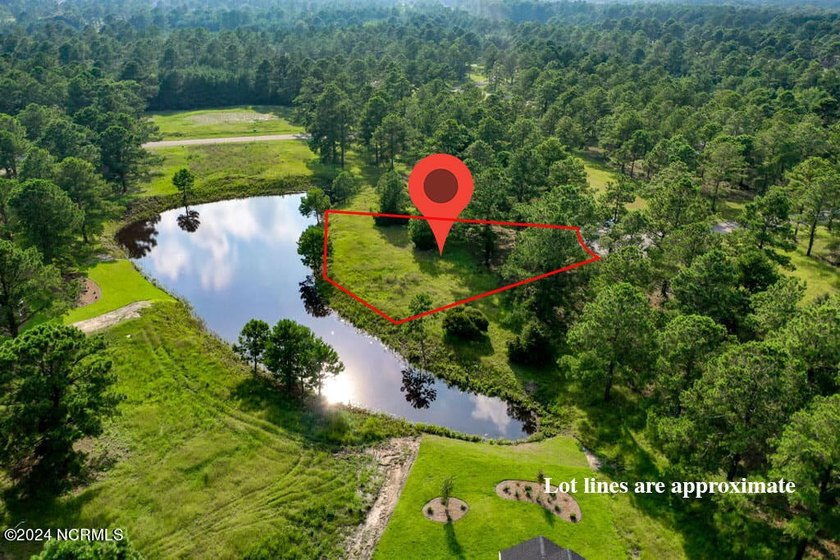 Positioned along a tranquil pond in the sought-after Haddington - Beach Lot for sale in Sunset Beach, North Carolina on Beachhouse.com