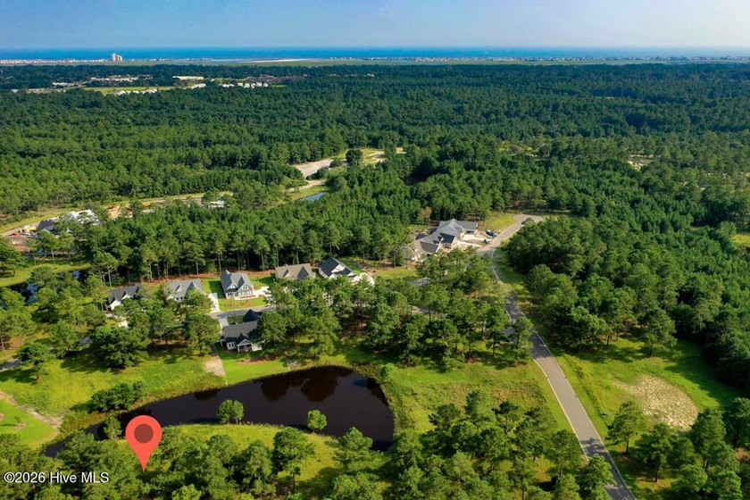 Set along the same scenic pond in the desirable Haddington Place - Beach Lot for sale in Sunset Beach, North Carolina on Beachhouse.com
