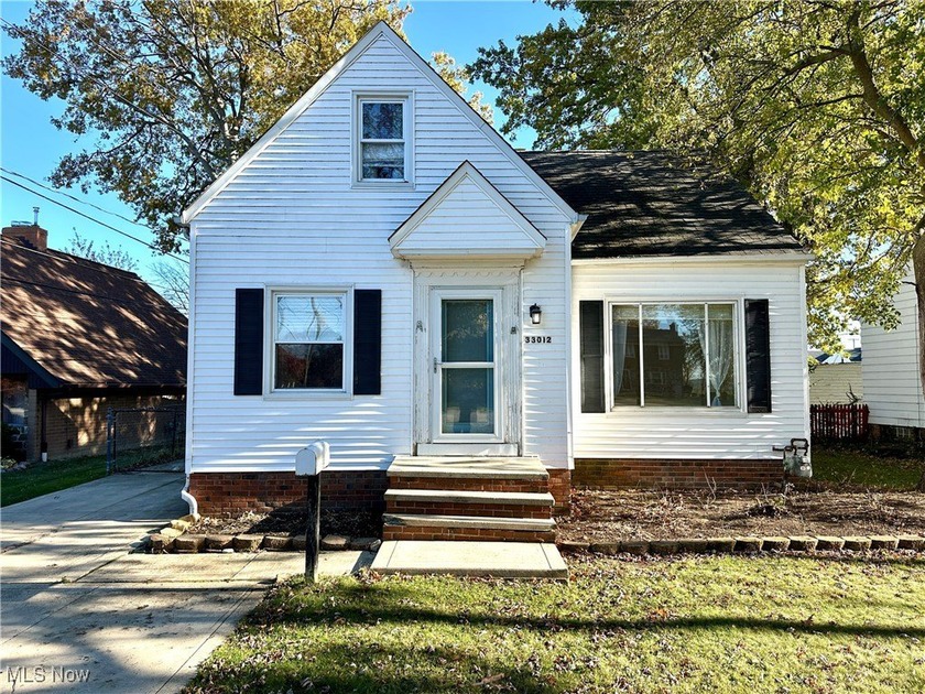 Enjoy lake views and endless potential with this 3-bedroom - Beach Home for sale in Willowick, Ohio on Beachhouse.com