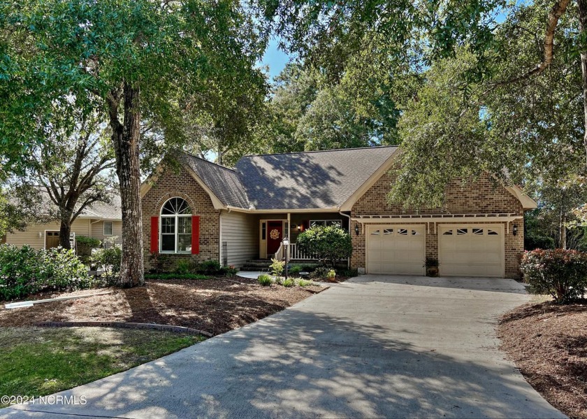 This open concept home in Sea Trail Plantation is ideal for - Beach Home for sale in Sunset Beach, North Carolina on Beachhouse.com