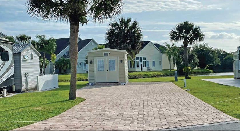 This 40'x80' brick paver RV site includes a 10'x14' shed with - Beach Lot for sale in Titusville, Florida on Beachhouse.com
