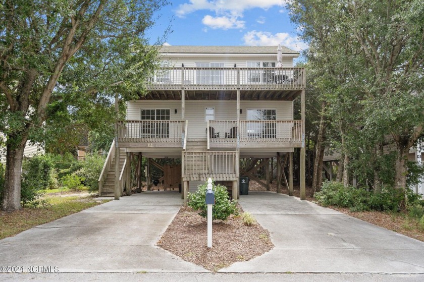 You won't want to miss this home tucked in amongst the Live Oaks - Beach Home for sale in Surf City, North Carolina on Beachhouse.com