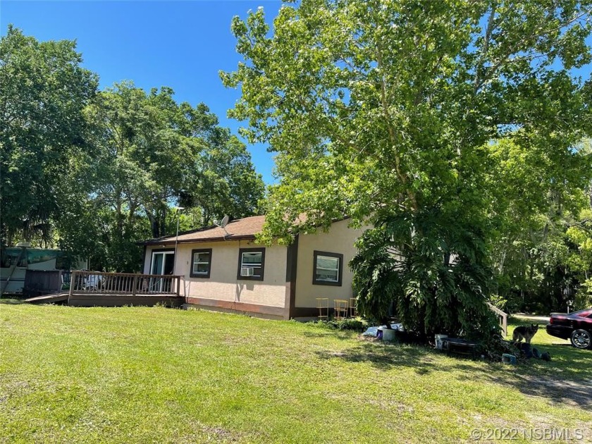 LOG CABIN ON 2.5 ACRES WITH A POND! INCLUDES 48 X 32 COVERED - Beach Home for sale in Edgewater, Florida on Beachhouse.com