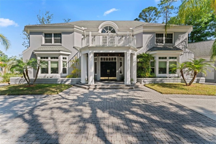 Stunning 4-bedroom, 4-bath pool home with office and serene pond - Beach Home for sale in Tampa, Florida on Beachhouse.com