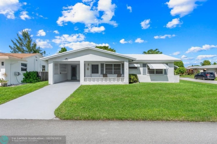 Welcome home to this well maintained single-family residence and - Beach Home for sale in Tamarac, Florida on Beachhouse.com