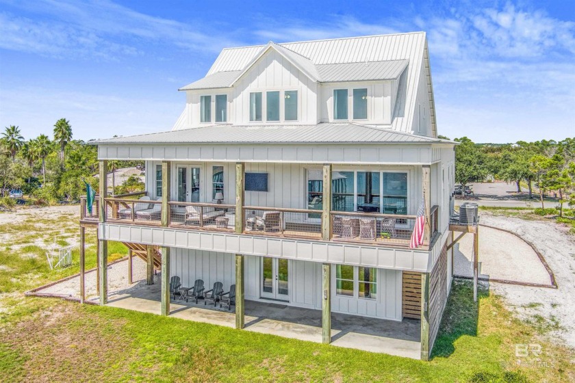 This stunning 5-bedroom, 4 1/2-bath home nestled alongside the - Beach Home for sale in Orange Beach, Alabama on Beachhouse.com