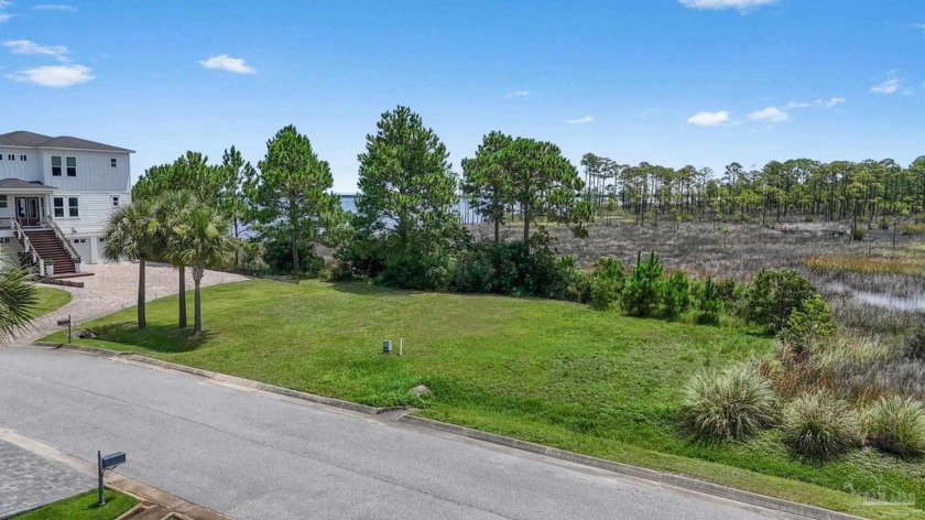 Nestled in the serene, gated community of Clipper Bay, this - Beach Lot for sale in Gulf Breeze, Florida on Beachhouse.com