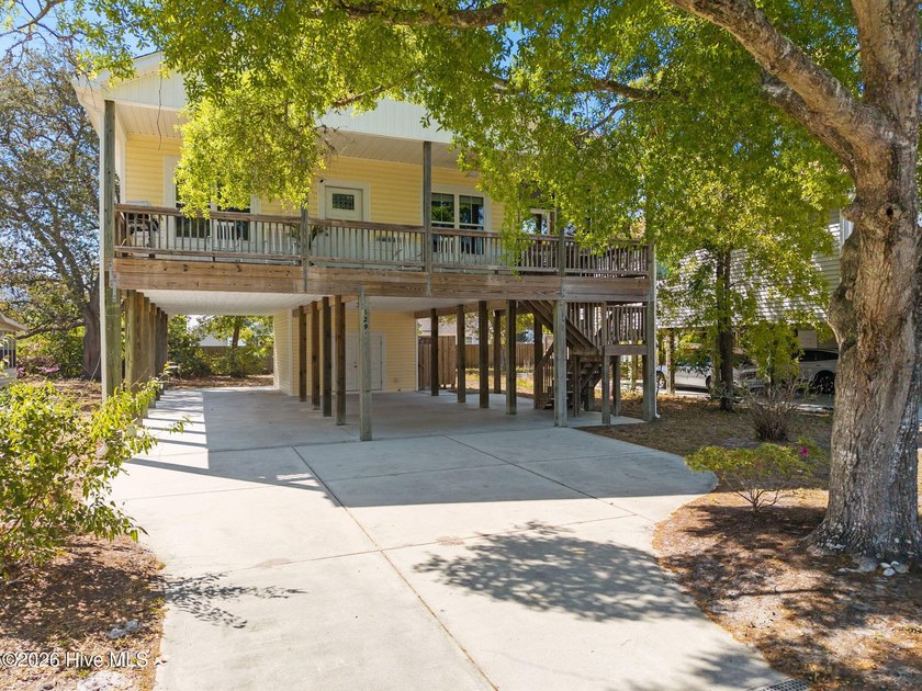 There's a certain kind of coastal home that feels immediately - Beach Home for sale in Oak Island, North Carolina on Beachhouse.com