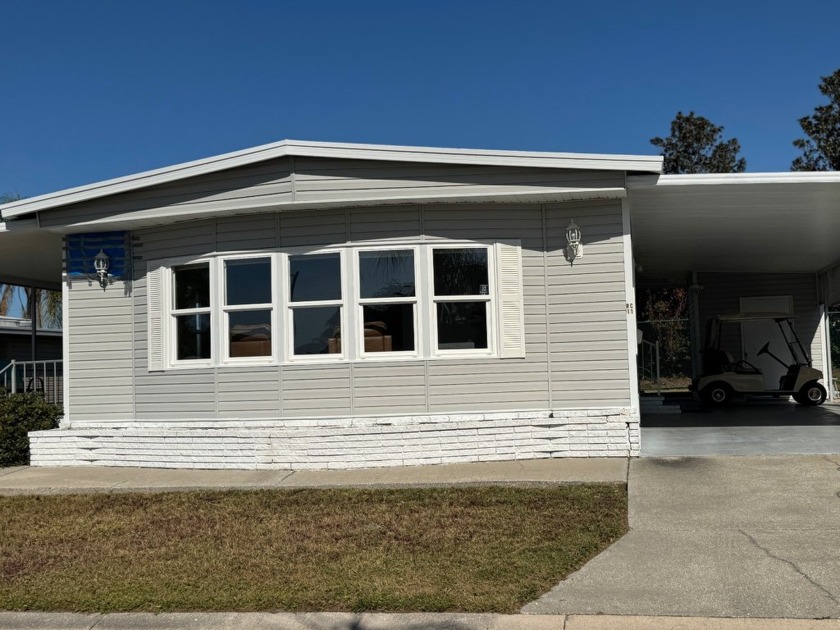 This elegantly updated 1973 home offers modern charm and - Beach Home for sale in Bradenton, Florida on Beachhouse.com