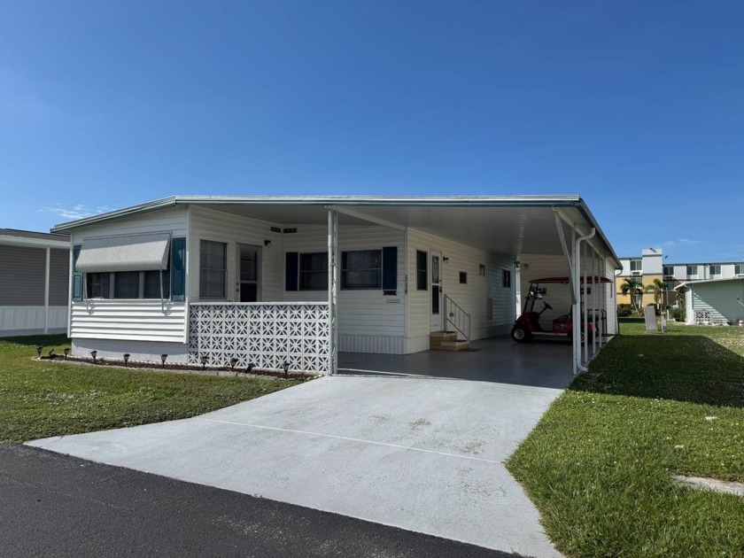 This 1971 home is offered turnkey and includes the golf cart! - Beach Home for sale in Bradenton, Florida on Beachhouse.com