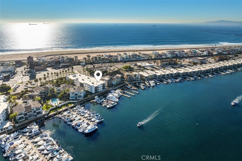 Experience waterfront living with stunning panoramic views in - Beach Condo for sale in Huntington Beach, California on Beachhouse.com