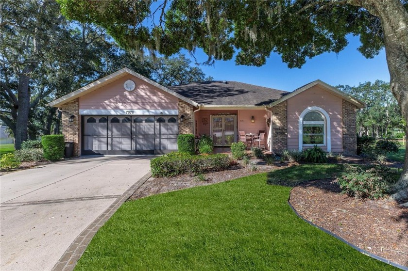 Nestled on a serene cul-de-sac within the gated country club - Beach Home for sale in Spring Hill, Florida on Beachhouse.com