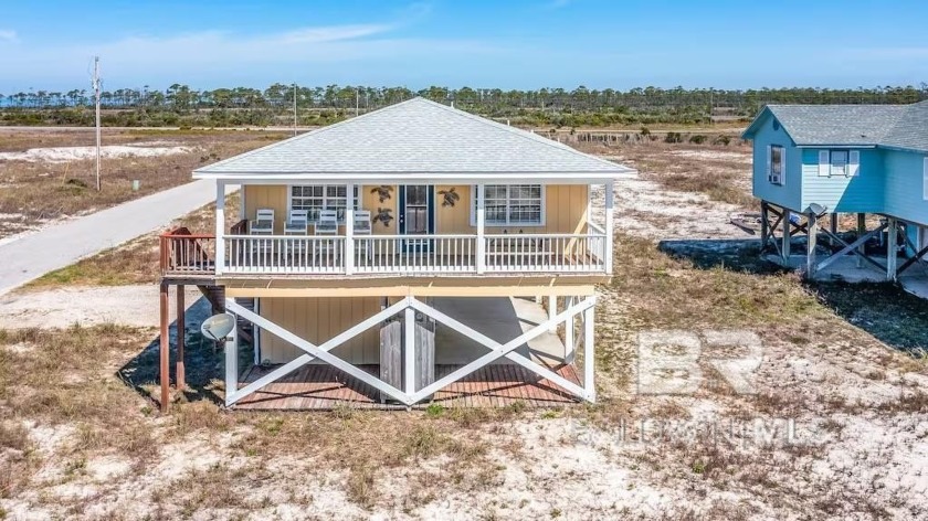 Discover coastal charm at its finest in this beautifully updated - Beach Home for sale in Gulf Shores, Alabama on Beachhouse.com