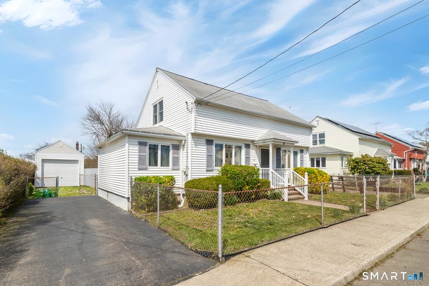 Just steps from Point Beach, this classic Cape Cod-style home - Beach Home for sale in Milford, Connecticut on Beachhouse.com