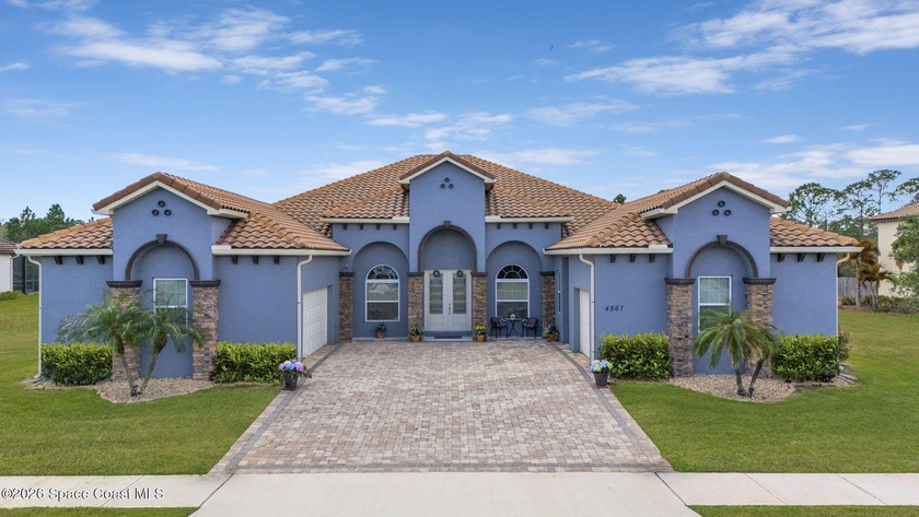 A RARE BLEND OF PRIVACY, SPACE & LUXURY! Custom-built & set on a - Beach Home for sale in Melbourne, Florida on Beachhouse.com