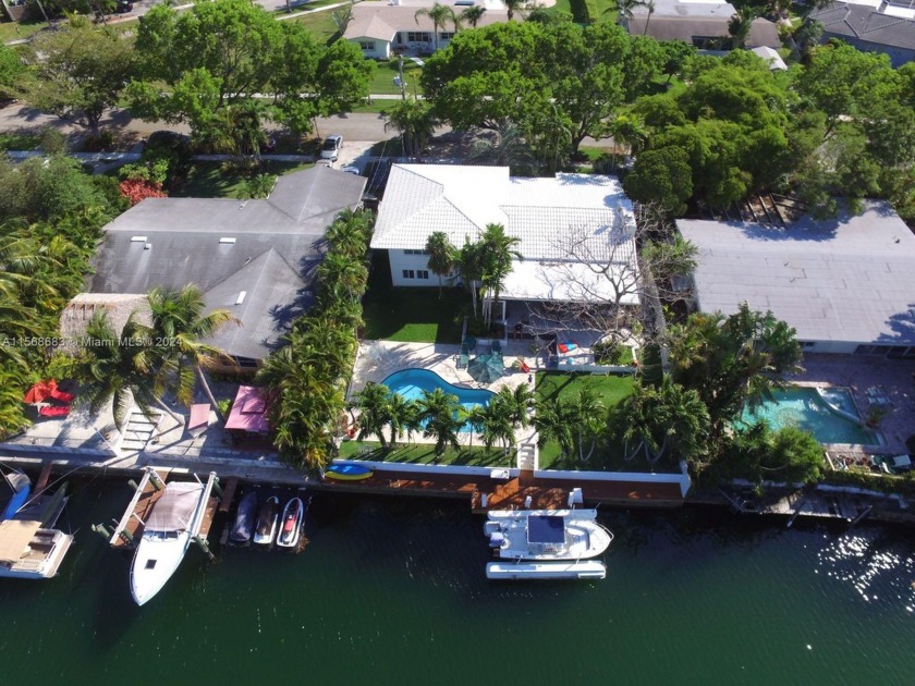 This charming split-level waterfront home offers swift access to - Beach Home for sale in North Miami, Florida on Beachhouse.com