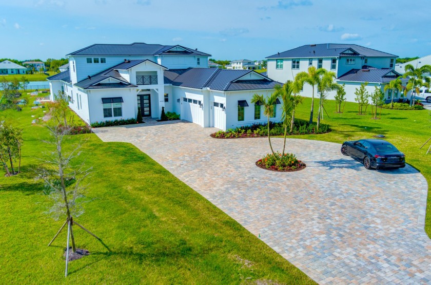 STUNNING CUSTOM HOME PRIVATELY NESTLED ON NEARLY 1 AC LOT - Beach Home for sale in Jupiter, Florida on Beachhouse.com