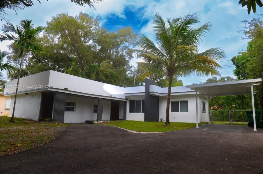 Come Enjoy the Oasis that boasts 3 bedrooms and 2 baths and an - Beach Home for sale in Miami, Florida on Beachhouse.com