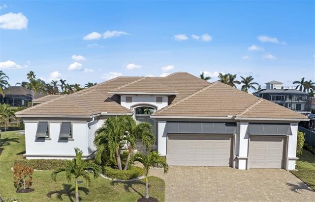 Situated on a premium tip lot, this waterfront canal home - Beach Home for sale in Marco Island, Florida on Beachhouse.com