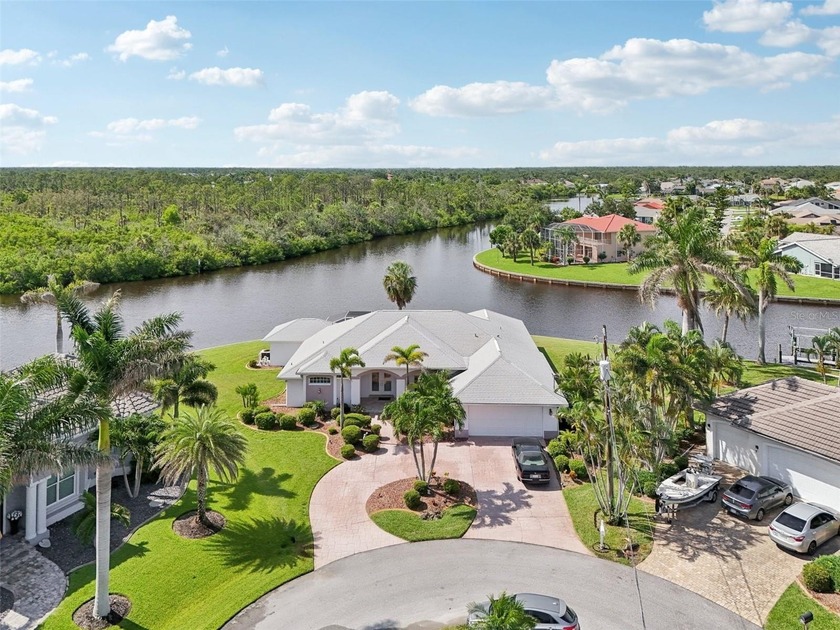 Start living your best life now in this exquisite WATERFRONT - Beach Home for sale in Port Charlotte, Florida on Beachhouse.com