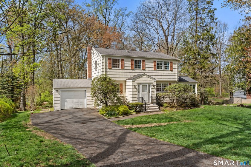 This classic 4-bedroom, 1.5-bath Colonial is tucked away on a - Beach Home for sale in Fairfield, Connecticut on Beachhouse.com