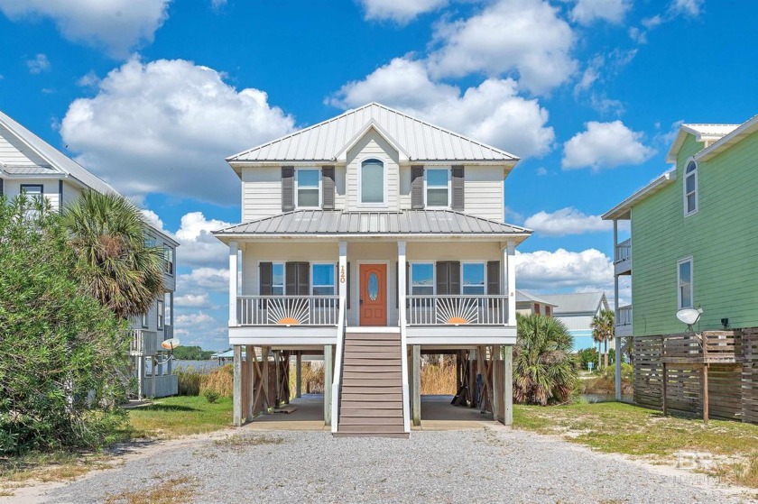 Discover coastal living at its finest with this waterfront home - Beach Home for sale in Gulf Shores, Alabama on Beachhouse.com