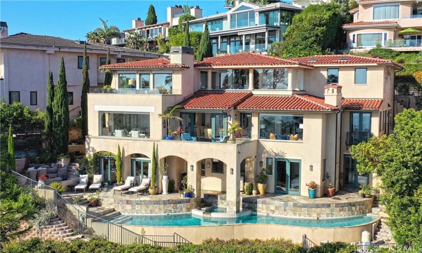 As you enter this elegant Tuscan style home you are greeted by - Beach Home for sale in Laguna Beach, California on Beachhouse.com