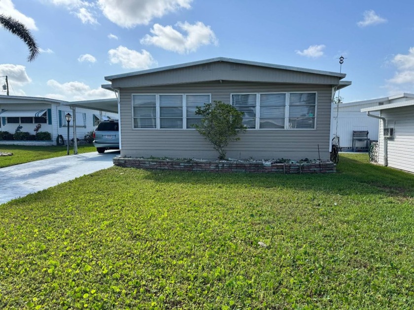 Welcome to this charming and inviting1967 double-wide home, With - Beach Home for sale in Bradenton, Florida on Beachhouse.com