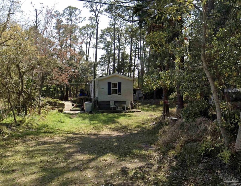 This buildable property is situated just north of the Woodlawn - Beach Home for sale in Gulf Breeze, Florida on Beachhouse.com