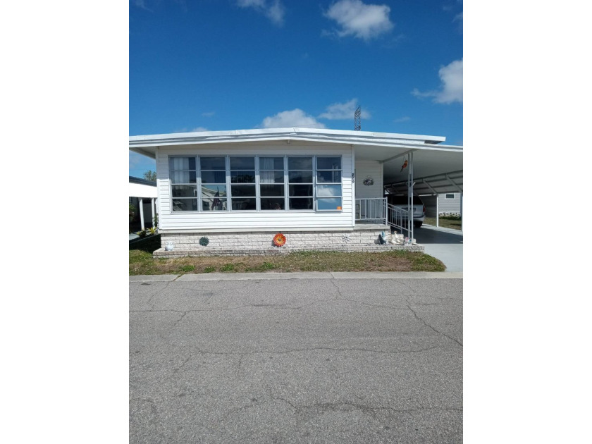 This 2 bedroom, 2 bath doublewide mobile home in a 55 + - Beach Home for sale in Largo, Florida on Beachhouse.com