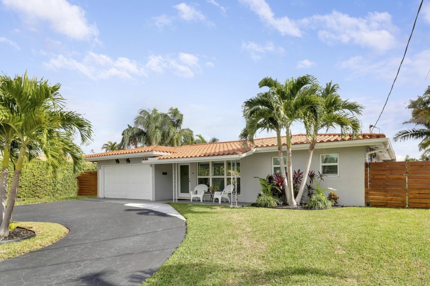 This exceptional waterfront retreat in the desirable Garden - Beach Home for sale in Pompano Beach, Florida on Beachhouse.com