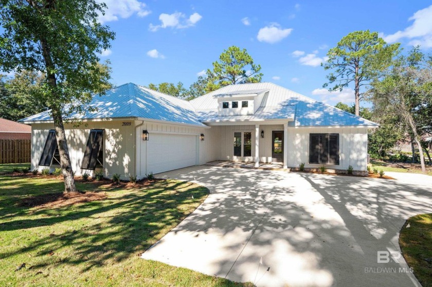 Welcome to this stunning 4-bedroom, 3-bathroom coastal home with - Beach Home for sale in Orange Beach, Alabama on Beachhouse.com