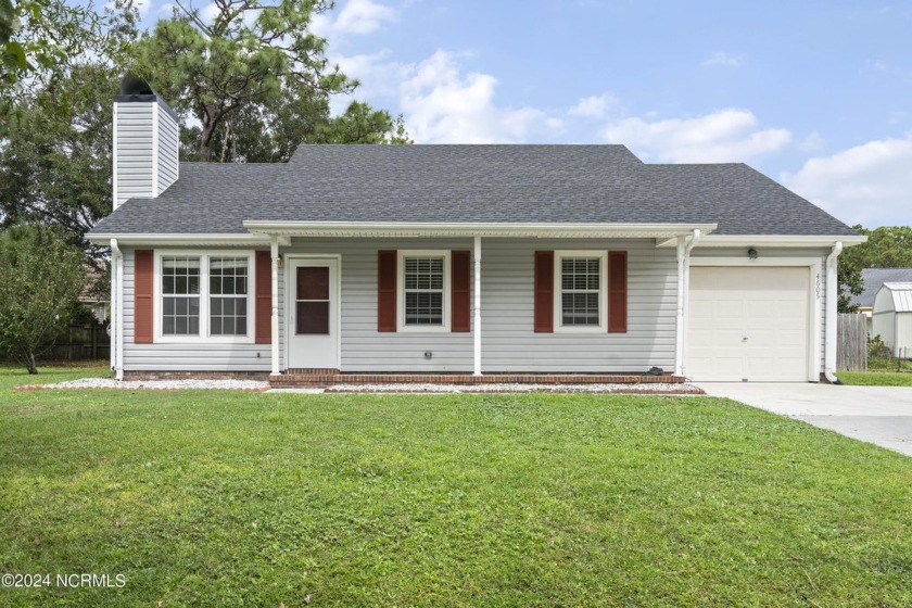 This move-in ready 3-bedroom, 2-bath home sits on an oversized - Beach Home for sale in Wilmington, North Carolina on Beachhouse.com