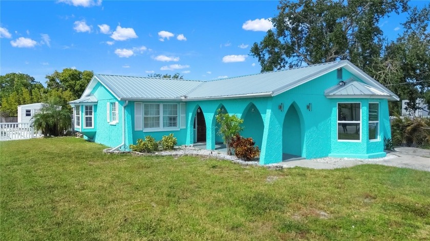 Coastal charm meets modern comfort in this renovated waterfront - Beach Home for sale in Hudson, Florida on Beachhouse.com