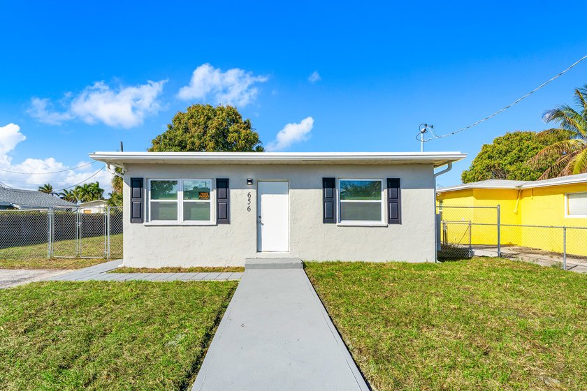 Welcome to this beautifully updated single-family home in the - Beach Home for sale in Riviera Beach, Florida on Beachhouse.com