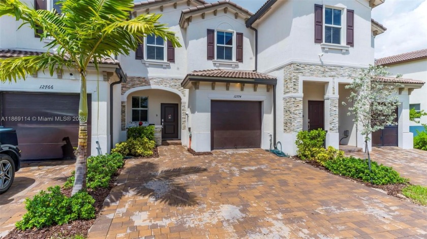 Breathtaking lake views await in this stunning 3-bedroom, 2 - Beach Townhome/Townhouse for sale in Miami, Florida on Beachhouse.com