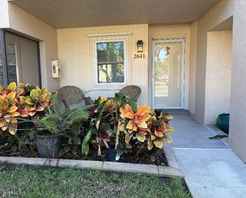 This charming 2-bedroom, 2-bath first-floor corner condo offers - Beach Condo for sale in Sarasota, Florida on Beachhouse.com