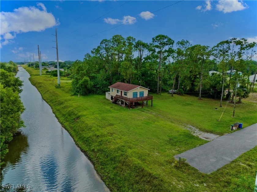 Welcome to this peaceful 3/1 home on an OVERSIZED 1/2 ACRE - Beach Home for sale in Lehigh Acres, Florida on Beachhouse.com