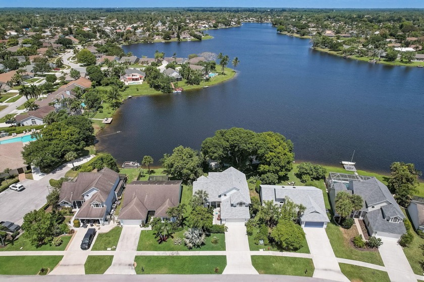 Exquisite three bedroom 2.5 baths house is a rare find on Lake - Beach Home for sale in Wellington, Florida on Beachhouse.com