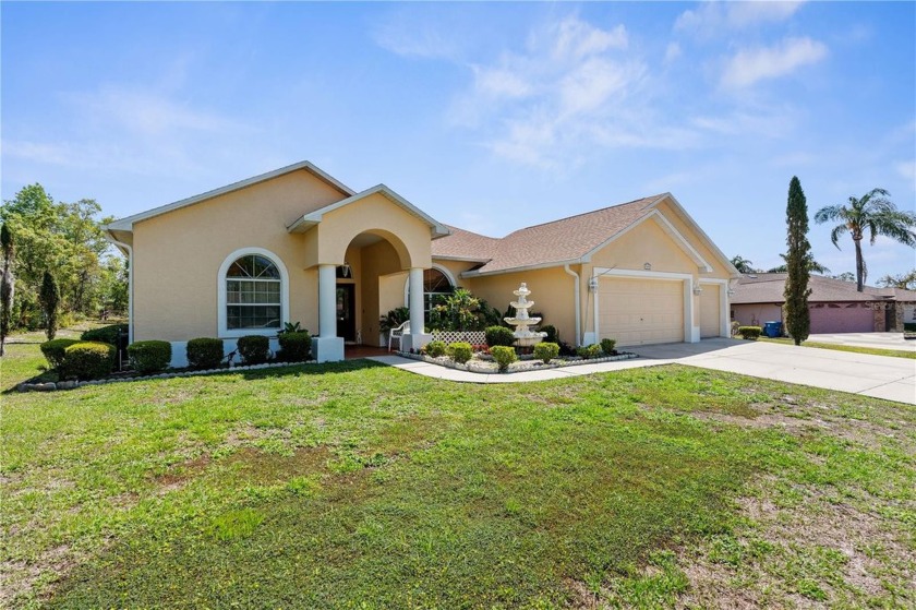 WHAT A MAGNIFICENT HOME ON THE OAK HILL GOLF COURSE! This - Beach Home for sale in Spring Hill, Florida on Beachhouse.com