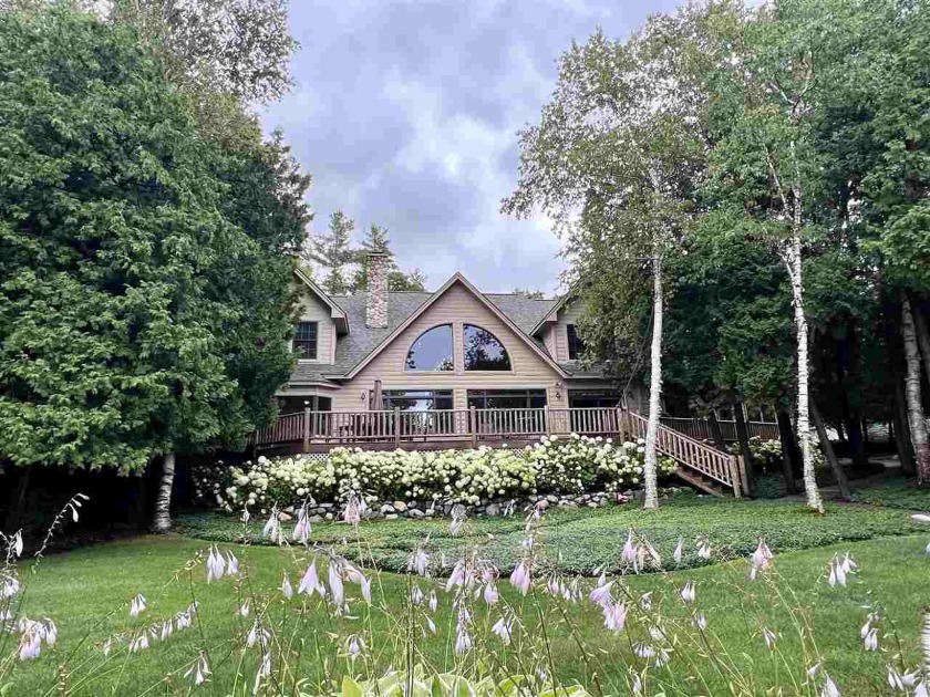 This classic Town & Country home is perfectly located on the - Beach Home for sale in Petoskey, Michigan on Beachhouse.com