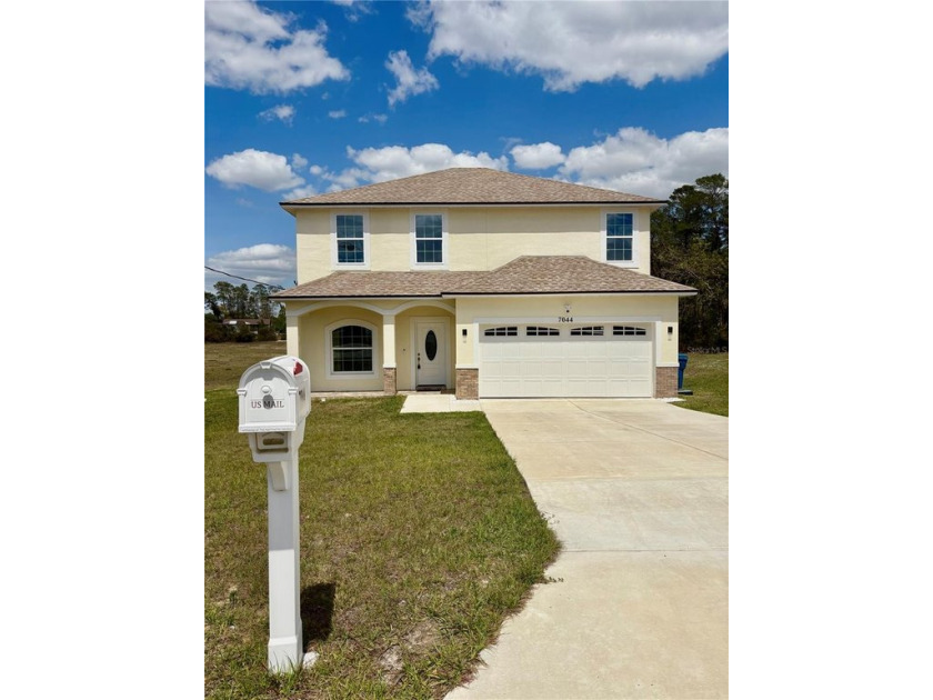 Welcome to 7044 Brickell Court, a delightful 4-bedroom, 2 - Beach Home for sale in Spring Hill, Florida on Beachhouse.com